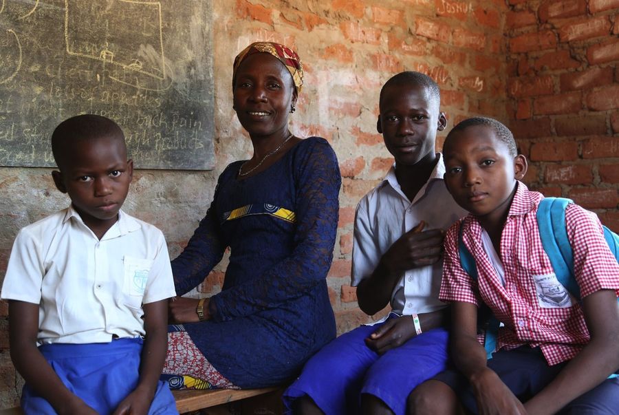 Christine Baptist, Parent, Sunrise Nursery and Primary School, Yambio, South Sudan<br>L-r:12 year old Christine, the mother/parent also Christine, 16 year old Evaresto and 10 year old Kubako